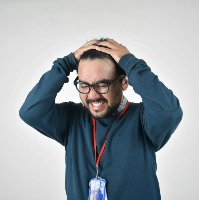man in bluee ssweater